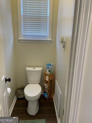 3955 Sweetwater Pkwy, Ellenwood, GA 30294 - bathroom featuring wood finished floors, toilet, and baseboards