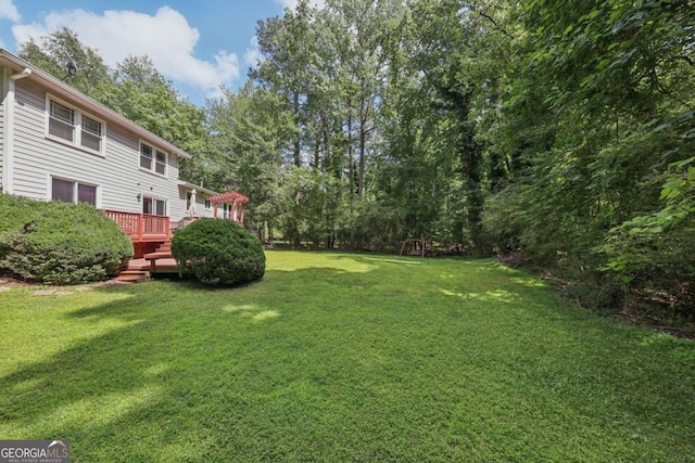 1487 W Bend Creek Ct, Atlanta, GA 30338 - view of grassy yard with a deck