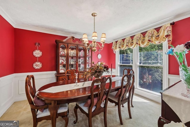 1487 W Bend Creek Ct, Atlanta, GA 30338 - dining area featuring a chandelier, carpet, crown molding, and a wainscoted wall