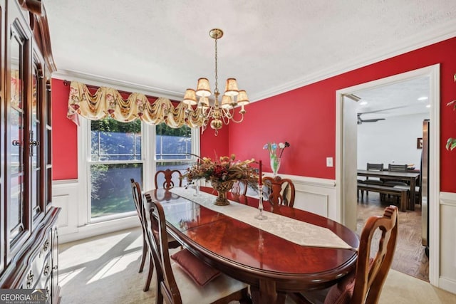 1487 W Bend Creek Ct, Atlanta, GA 30338 - carpeted dining area featuring ornamental molding, a chandelier, wainscoting, and a decorative wall