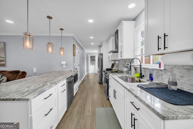 557 Spring Creek Way NE, Marietta, GA 30068 - kitchen featuring appliances with stainless steel finishes, a sink, tasteful backsplash, light wood-style flooring, and recessed lighting
