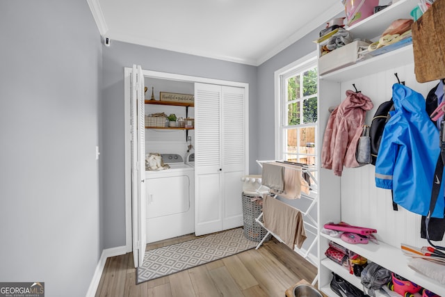 557 Spring Creek Way NE, Marietta, GA 30068 - mudroom featuring crown molding, light wood finished floors, washing machine and clothes dryer, and baseboards