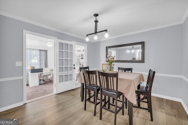 557 Spring Creek Way NE, Marietta, GA 30068 - dining room with french doors, plenty of natural light, crown molding, wood finished floors, and baseboards