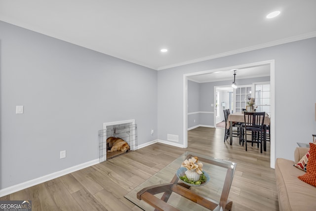557 Spring Creek Way NE, Marietta, GA 30068 - living room with baseboards, wood finished floors, crown molding, and recessed lighting