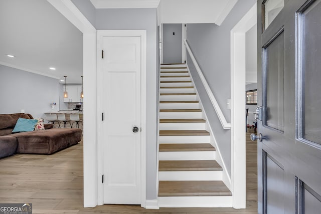 557 Spring Creek Way NE, Marietta, GA 30068 - staircase with wood finished floors, recessed lighting, and ornamental molding