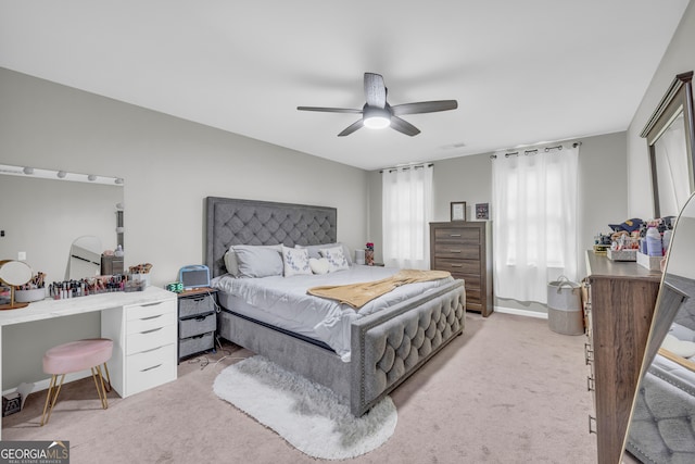 557 Spring Creek Way NE, Marietta, GA 30068 - bedroom with light carpet and ceiling fan