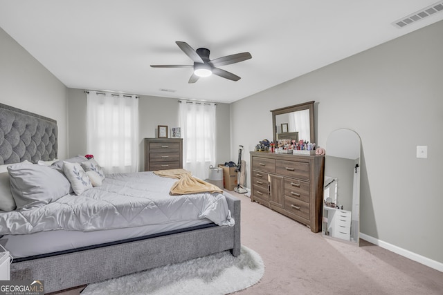 557 Spring Creek Way NE, Marietta, GA 30068 - bedroom with light colored carpet, ceiling fan, and baseboards