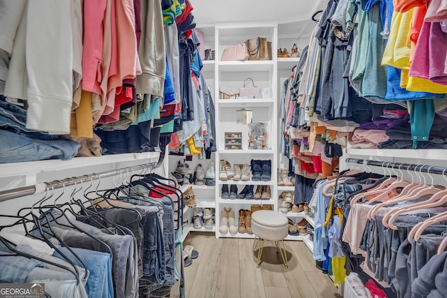 557 Spring Creek Way NE, Marietta, GA 30068 - walk in closet featuring wood finished floors