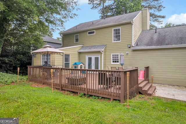 557 Spring Creek Way NE, Marietta, GA 30068 - rear view of property featuring french doors, a gazebo, a deck, and a lawn