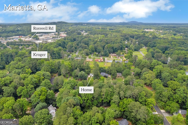 557 Spring Creek Way NE, Marietta, GA 30068 - aerial view of a heavily wooded area