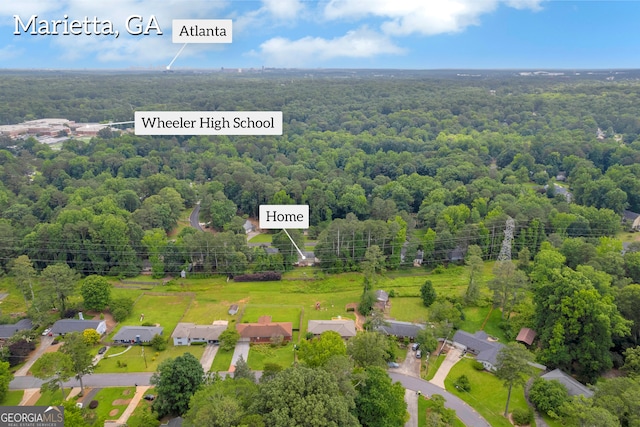 557 Spring Creek Way NE, Marietta, GA 30068 - aerial view of property's location with a heavily wooded area