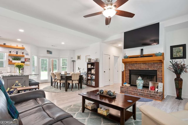 30 Kirby Cir, Newnan, GA 30263 - living room featuring light wood-type flooring, ceiling fan, recessed lighting, and a brick fireplace