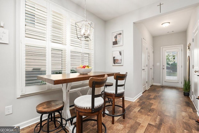 6115 Stella Light Dr, Flowery Branch, GA 30542 - dining area with baseboards, dark wood-style floors, and a chandelier
