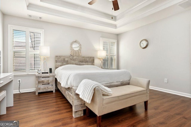 6115 Stella Light Dr, Flowery Branch, GA 30542 - bedroom featuring a tray ceiling, ornamental molding, multiple windows, dark wood-style floors, and baseboards
