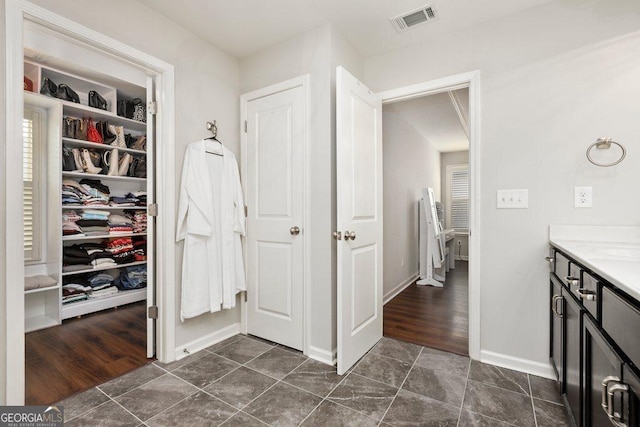 6115 Stella Light Dr, Flowery Branch, GA 30542 - corridor featuring baseboards and dark tile patterned floors