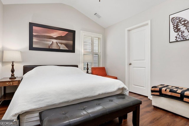 6115 Stella Light Dr, Flowery Branch, GA 30542 - bedroom featuring dark wood finished floors and vaulted ceiling