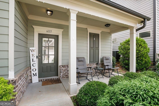 6115 Stella Light Dr, Flowery Branch, GA 30542 - view of exterior entry featuring covered porch
