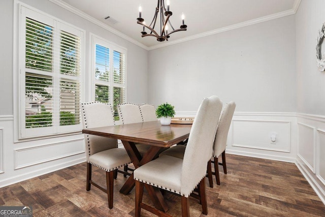 6115 Stella Light Dr, Flowery Branch, GA 30542 - dining space featuring a chandelier, ornamental molding, a decorative wall, dark wood-type flooring, and a wainscoted wall