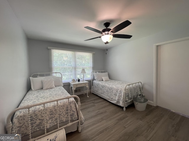 424 Harkins Rd, Cleveland, GA 30528 - bedroom featuring dark wood-style flooring, a ceiling fan, and baseboards