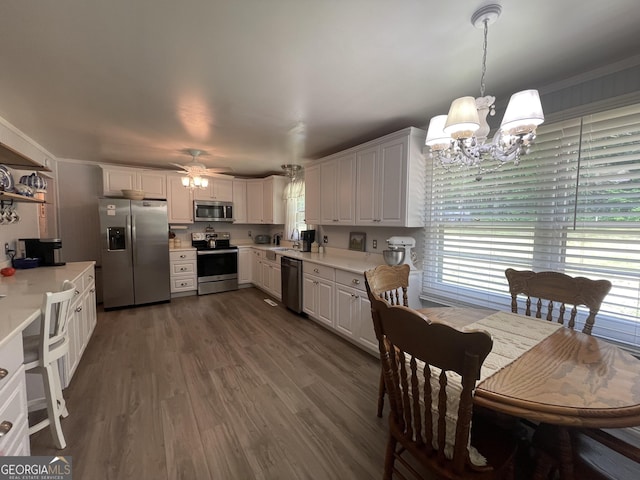 424 Harkins Rd, Cleveland, GA 30528 - kitchen featuring appliances with stainless steel finishes, a chandelier, light countertops, and white cabinetry
