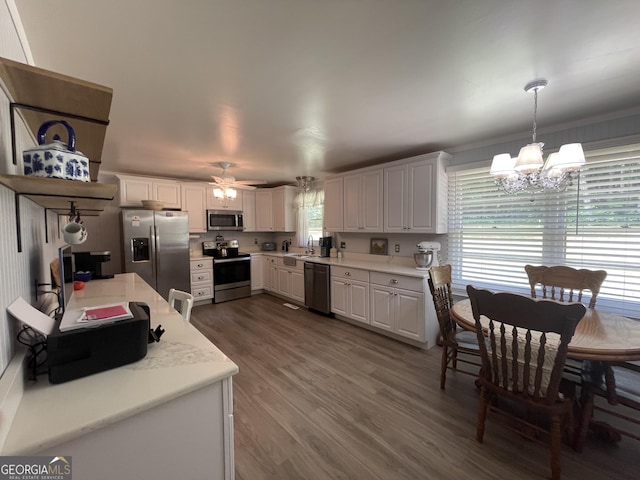 424 Harkins Rd, Cleveland, GA 30528 - kitchen featuring appliances with stainless steel finishes, a chandelier, white cabinets, and light countertops