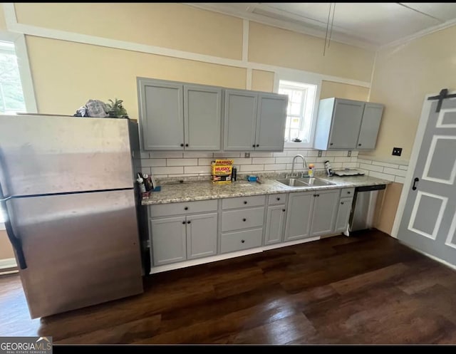 44 Freeman, Heflin, AL 36264 - kitchen featuring stainless steel appliances, gray cabinets, crown molding, dark wood-style floors, and tasteful backsplash