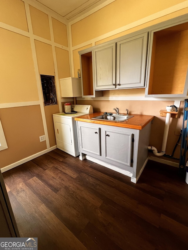 44 Freeman, Heflin, AL 36264 - kitchen featuring washer / dryer, dark wood-style floors, and light countertops
