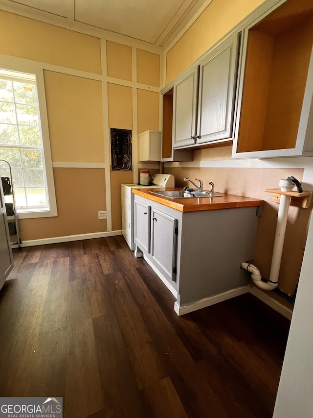 44 Freeman, Heflin, AL 36264 - kitchen with dark wood-style flooring, butcher block countertops, and washer / clothes dryer