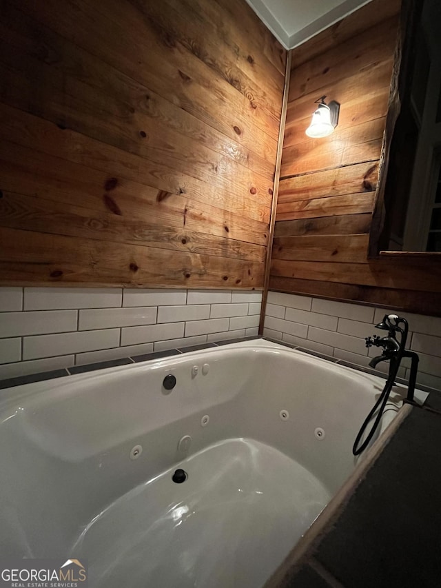 44 Freeman, Heflin, AL 36264 - full bathroom featuring wooden walls and a whirlpool tub