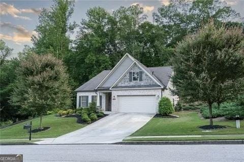 1325 Burnam Wood Dr, Gainesville, GA 30501 - view of front of property featuring driveway, an attached garage, and a yard