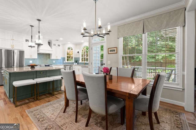 220 Webley Ln, Alpharetta, GA 30022 - dining area with a chandelier, ornamental molding, light wood-type flooring, and baseboards