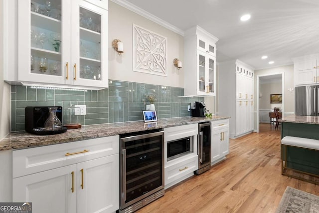220 Webley Ln, Alpharetta, GA 30022 - kitchen featuring wine cooler, freestanding refrigerator, crown molding, white cabinets, and recessed lighting