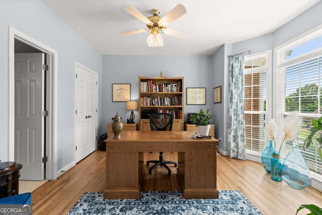 220 Webley Ln, Alpharetta, GA 30022 - home office featuring light wood finished floors, a ceiling fan, and baseboards