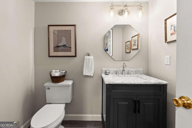 220 Webley Ln, Alpharetta, GA 30022 - bathroom with toilet, baseboards, vanity, and wood finished floors