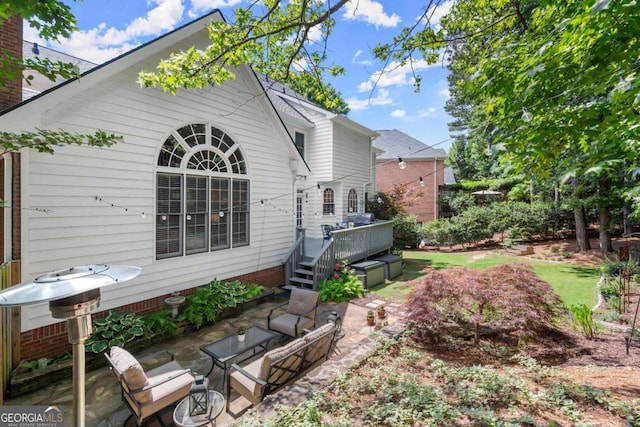 220 Webley Ln, Alpharetta, GA 30022 - rear view of house featuring a deck and a patio area