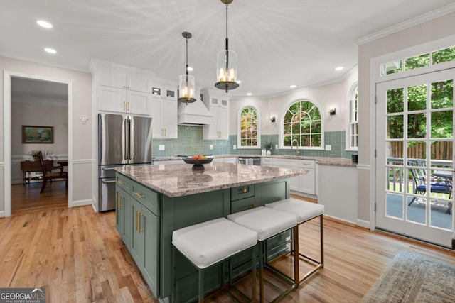 220 Webley Ln, Alpharetta, GA 30022 - kitchen with stainless steel appliances, white cabinets, custom exhaust hood, a kitchen island, and backsplash