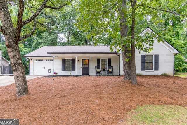2038 Summertown Dr, Norcross, GA 30071 - ranch-style house featuring a porch, a garage, and driveway