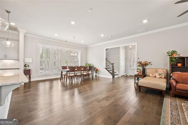 993 Harvest Park Ln, Suwanee, GA 30024 - dining area with crown molding, dark wood-type flooring, a ceiling fan, recessed lighting, and stairs
