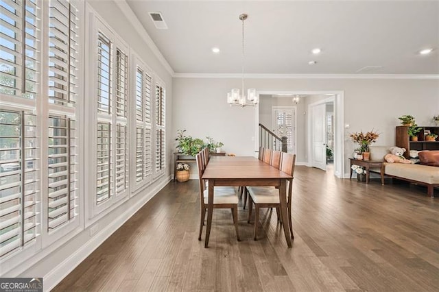 993 Harvest Park Ln, Suwanee, GA 30024 - dining room with plenty of natural light, a chandelier, wood finished floors, ornamental molding, and recessed lighting