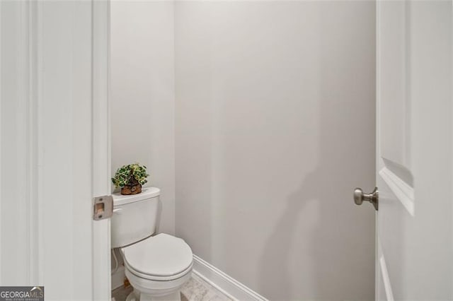 993 Harvest Park Ln, Suwanee, GA 30024 - bathroom featuring toilet and baseboards