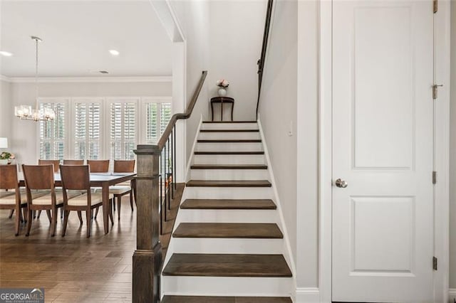 993 Harvest Park Ln, Suwanee, GA 30024 - staircase with wood finished floors, a chandelier, crown molding, and recessed lighting