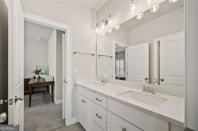 993 Harvest Park Ln, Suwanee, GA 30024 - bathroom with double vanity and baseboards