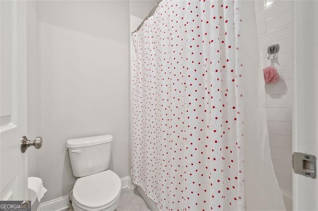 993 Harvest Park Ln, Suwanee, GA 30024 - bathroom featuring baseboards and toilet