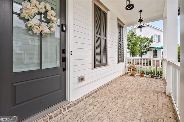 993 Harvest Park Ln, Suwanee, GA 30024 - view of exterior entry featuring covered porch