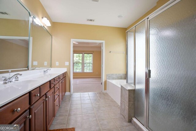 12194 Limeridge Ct, Alpharetta, GA 30004 - bathroom featuring double vanity, a garden tub, tile patterned flooring, and a stall shower