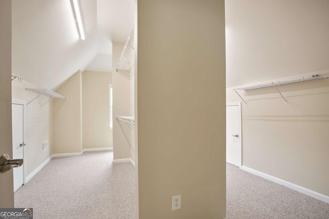 12194 Limeridge Ct, Alpharetta, GA 30004 - spacious closet featuring carpet and vaulted ceiling