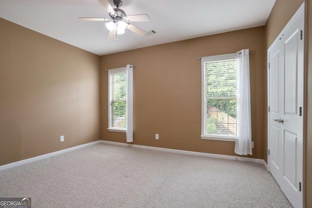 12194 Limeridge Ct, Alpharetta, GA 30004 - empty room with light carpet and ceiling fan