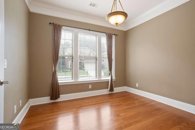 12194 Limeridge Ct, Alpharetta, GA 30004 - spare room with plenty of natural light, crown molding, and wood finished floors