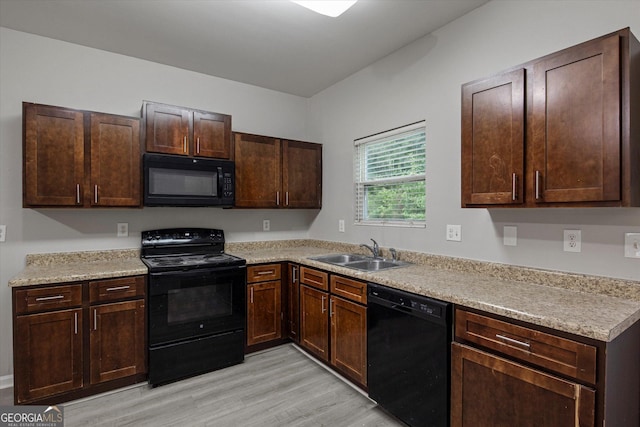 2137 Chadwick Rd SW, Atlanta, GA 30331 - kitchen featuring black appliances, a sink, light wood-style flooring, light countertops, and dark brown cabinetry