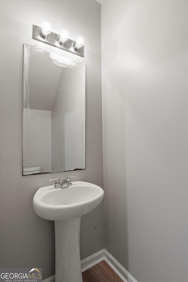 2137 Chadwick Rd SW, Atlanta, GA 30331 - bathroom with wood finished floors and baseboards